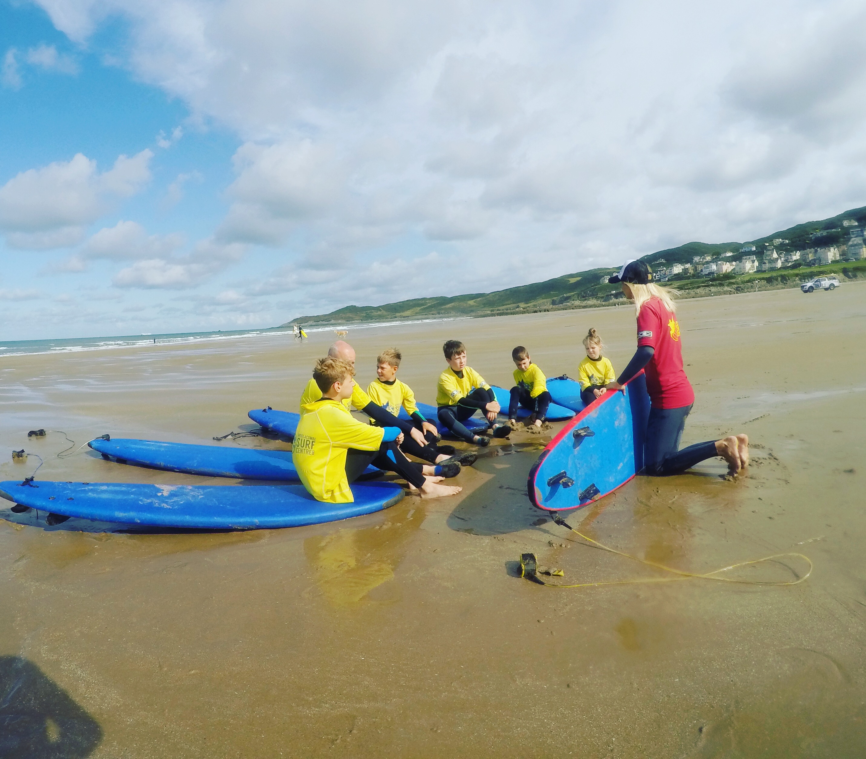 Beach theory surf lesson at Woolacombe Surf Centre, learning the basics and safety of surfing fundamentals, the best surf school Woolacombe, surfing woolacombe