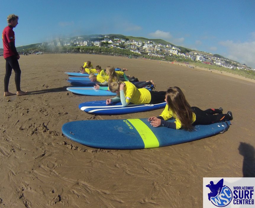 Grom squad surf training session with Woolacombe Surf Centre on Woolacombe beach, surfing in North Devon