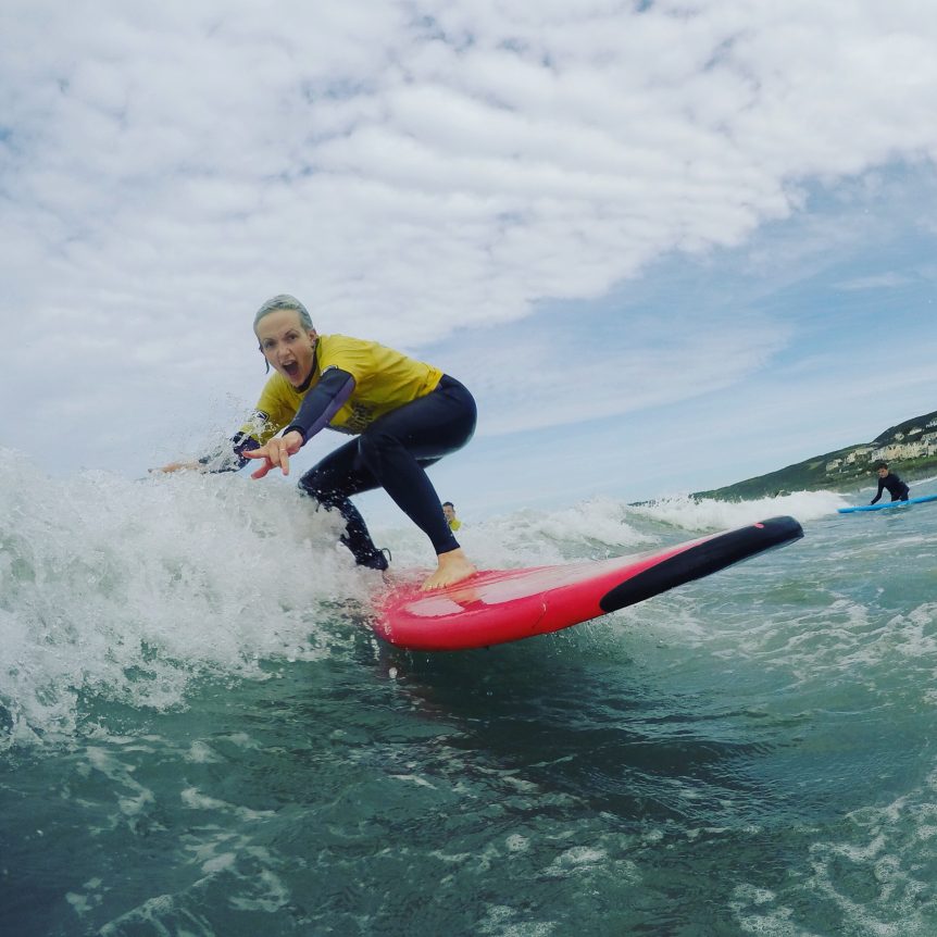 Beginner Intermediate surfer, surfing with Woolacombe Surf Centre at Woolacombe beach surf school